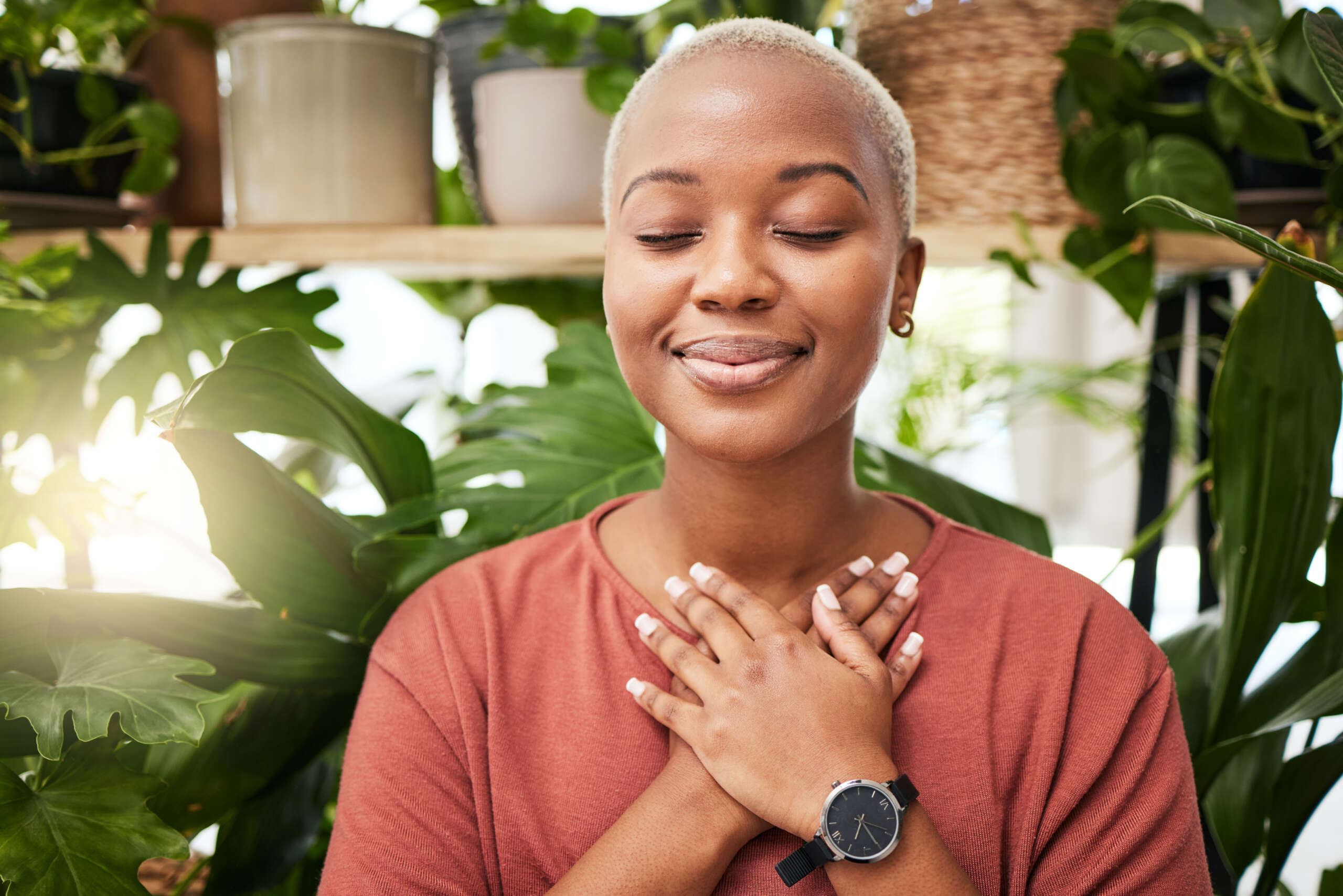 Zen, breathing and calm woman by plants for breathing exercise in meditation in a nursery. Breathe,.